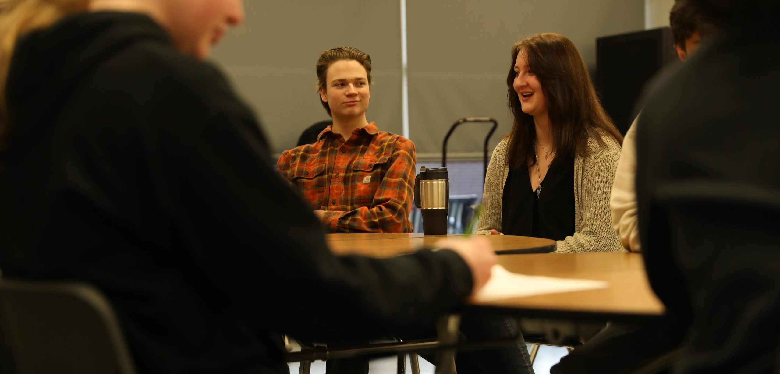 Students sitting at round table