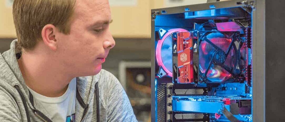 Student looks at glowing computer